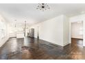 Open concept living space with updated lighting, seamless flow, and refinished wood floors at 1112 Concord Ave, Monroe, NC 28110