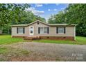 Charming single-story home with neutral siding, black shutters, and a well-manicured front lawn at 1245 Forest Ridge Rd, Bessemer City, NC 28016