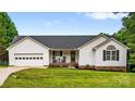 Charming one-story home with an attached garage and well-maintained front yard landscaping at 1377 Beagle Run, Salisbury, NC 28146