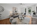 Cozy living room featuring neutral decor, hardwood floors, and a bright interior at 1556 Walnut View Dr, Charlotte, NC 28208