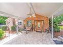 Inviting covered front porch with a fan and outdoor seating area, perfect for relaxing at 211 Drive Inn Rd, Locust, NC 28097