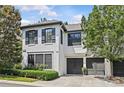 Charming two-story home with well-manicured landscaping, a two-car garage, and stylish black shutters at 224 Wendover Heights Cir, Charlotte, NC 28211