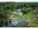 Expansive waterfront property featuring a well-maintained lawn and private dock at 2593 Las Brisas Ln, Denver, NC 28037