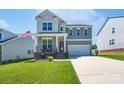 Charming two-story home with a covered porch and a bright red front door at 4117 Sunset Ridge Dr, Rock Hill, SC 29732