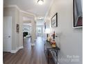 Inviting hallway with beautiful flooring and neutral paint, leading to the living areas at 4117 Sunset Ridge Dr, Rock Hill, SC 29732