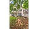 Charming two-story home with a well-manicured lawn and inviting front porch at 4502 Magnolia Ridge Dr, Waxhaw, NC 28173