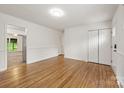 Open-concept living area featuring hardwood floors and neutral wall colors at 4533 Gainesborough Rd, Charlotte, NC 28205