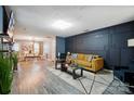 Stylish living room boasts hardwood floors, modern lighting, and contemporary decor with lots of open space at 4916 Oak Pasture Ln, Charlotte, NC 28269