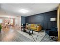Stylish living room boasts hardwood floors, modern lighting, and contemporary decor with lots of open space at 4916 Oak Pasture Ln, Charlotte, NC 28269