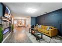 Stylish living room boasts hardwood floors, modern lighting, and contemporary decor with lots of open space at 4916 Oak Pasture Ln, Charlotte, NC 28269