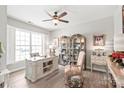 Well-lit home office with a large window, stylish desk, and ample storage for an inviting workspace at 5002 Samoa Ridge Dr, Lancaster, SC 29270