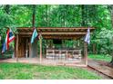 Entertaining outdoor bar featuring wooden construction and festive lighting at 625 S Magnolia St, Mooresville, NC 28115