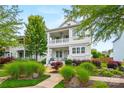 Charming two-story white home with inviting double porches and a well-manicured front garden at 790 Herrons Ferry Rd, Rock Hill, SC 29730