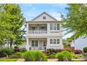 Charming two-story home with a welcoming front porch and beautifully maintained landscaping at 790 Herrons Ferry Rd, Rock Hill, SC 29730