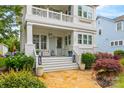 Inviting front porch with stone pathway, stylish seating, and classic architectural details at 790 Herrons Ferry Rd, Rock Hill, SC 29730