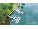 An aerial view of the community dock with multiple boat slips in a tranquil body of water at 8259 Camelia Ln, Denver, NC 28037