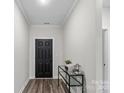 Inviting home foyer with an elegant console table, offering a glimpse of the home's interior at 9009 Myrna Dr, Gastonia, NC 28056