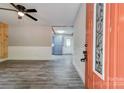 Bright living room featuring neutral tones, paneled walls, and modern gray flooring at 1010 Fallston Rd, Shelby, NC 28150