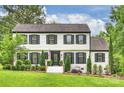 Traditional two-story home with a well-maintained front lawn and lovely curb appeal at 1119 Thornsby Ln, Matthews, NC 28105