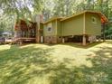 Large backyard with a partially enclosed porch and deck perfect for outdoor entertaining at 157 Old Hearth Rd, Clover, SC 29710
