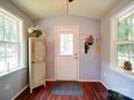 Bright foyer with hardwood floors, natural light, and a coat rack for convenience at 157 Old Hearth Rd, Clover, SC 29710