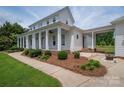 Charming two-story home with a covered porch, manicured landscaping, and a walkway at 1621 Lakefield Cir, Gastonia, NC 28056