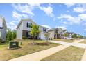 Suburban two-story home showcasing a well-maintained lawn, sidewalk and community street at 164 Shepherds Landing Dr, Mooresville, NC 28115
