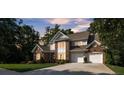 Beautiful brick home with meticulously maintained landscaping and a spacious driveway leading to the garage at 1747 30Th Avenue Ne Dr, Hickory, NC 28601