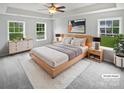 Spacious main bedroom with large windows, soft lighting, and neutral decor at 2479 N Legacy Park Blvd, Fort Mill, SC 29707