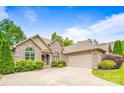 Beautiful brick home with an attached garage and well-kept lawn and garden at 305 River Birch Cir, Mooresville, NC 28115