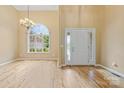Bright foyer with soaring ceilings, hardwood floors, and a grand window at 305 River Birch Cir, Mooresville, NC 28115