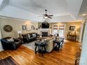 Inviting living room showcasing a fireplace, hardwood floors, and plenty of natural light at 3273 16Th Ne St, Hickory, NC 28601