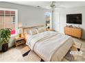 Bright main bedroom featuring neutral decor, ceiling fan and ample natural light at 3436 Ibis Ln, Fort Mill, SC 29707