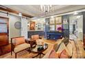 Inviting living room featuring stylish seating, unique decor, and ample lighting at 5357 Pembrey Dr, Denver, NC 28037