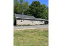 Newly renovated home with classic siding and a well-maintained yard, perfect for comfortable living and outdoor enjoyment at 850 And 830 E Nc 152 E Hwy, China Grove, NC 28023