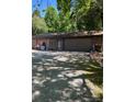 Spacious detached garage with ample storage, perfect for projects and parking, set on a gravel driveway at 850 And 830 E Nc 152 E Hwy, China Grove, NC 28023