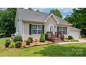 Charming one-story home with manicured lawn, updated landscaping, and a welcoming front porch at 1028 Pocono Pl, Newton, NC 28658