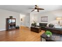 The living room features hardwood floors, a ceiling fan, and an open entryway at 1028 Pocono Pl, Newton, NC 28658
