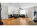 Cozy living room with natural light, hardwood floors, a ceiling fan, and modern decor at 1028 Pocono Pl, Newton, NC 28658