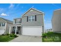 Well-maintained home with a two-car garage, a green lawn, and an inviting facade at 2013 Eastway Dr, Dallas, NC 28034