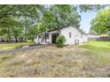 Renovated home with white brick, black trim, garage and large front yard at 2280 Cannon Farm Rd, China Grove, NC 28023