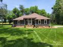 Front of charming single-story home with manicured lawn and neat landscaping, enhancing curb appeal at 2777 Old South Nw Ct, Concord, NC 28027