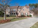 Spacious brick home with a three-car garage and a well-maintained lawn at 2785 Disney Pl, Indian Land, SC 29707