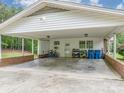 View of the spacious carport with an adjacent utility room and an abundance of storage options at 310 Yarbro Rd, Kings Mountain, NC 28086