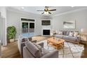 Comfortable living room with fireplace, ceiling fan, and access to the outdoor patio at 3104 Doncaster Dr, Rock Hill, SC 29732