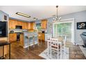 Eat-in kitchen with wood cabinets, a breakfast bar, and sliding glass doors at 3236 Wicklow Ln, Clover, SC 29710