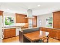 Well-lit kitchen with granite countertops, stainless steel appliances, ample cabinet space, and a kitchen island at 3916 Blowing Rock Way, Charlotte, NC 28210