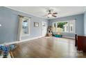 Bright and airy living room featuring hardwood floors, large windows, and neutral wall paint at 435 Sixteenth St, Cramerton, NC 28032