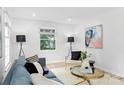 Bright living room with hardwood floors, ample natural light, and stylish furnishings at 4913 Seacroft Rd, Charlotte, NC 28210