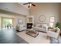 Bright and airy living room with a fireplace, vaulted ceiling, and stylish furnishings at 5436 Scarlet Sage Dr, Charlotte, NC 28215